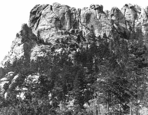 image: the Six Grandfathers mountain in South Dakota in 1905. Today it has been carved into present-day Mount Rushmore.
