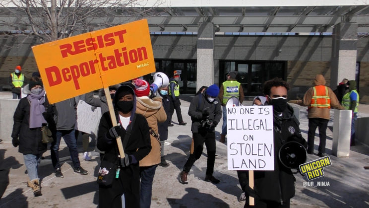 rally at ICE building calling for an end to the war on immigrants