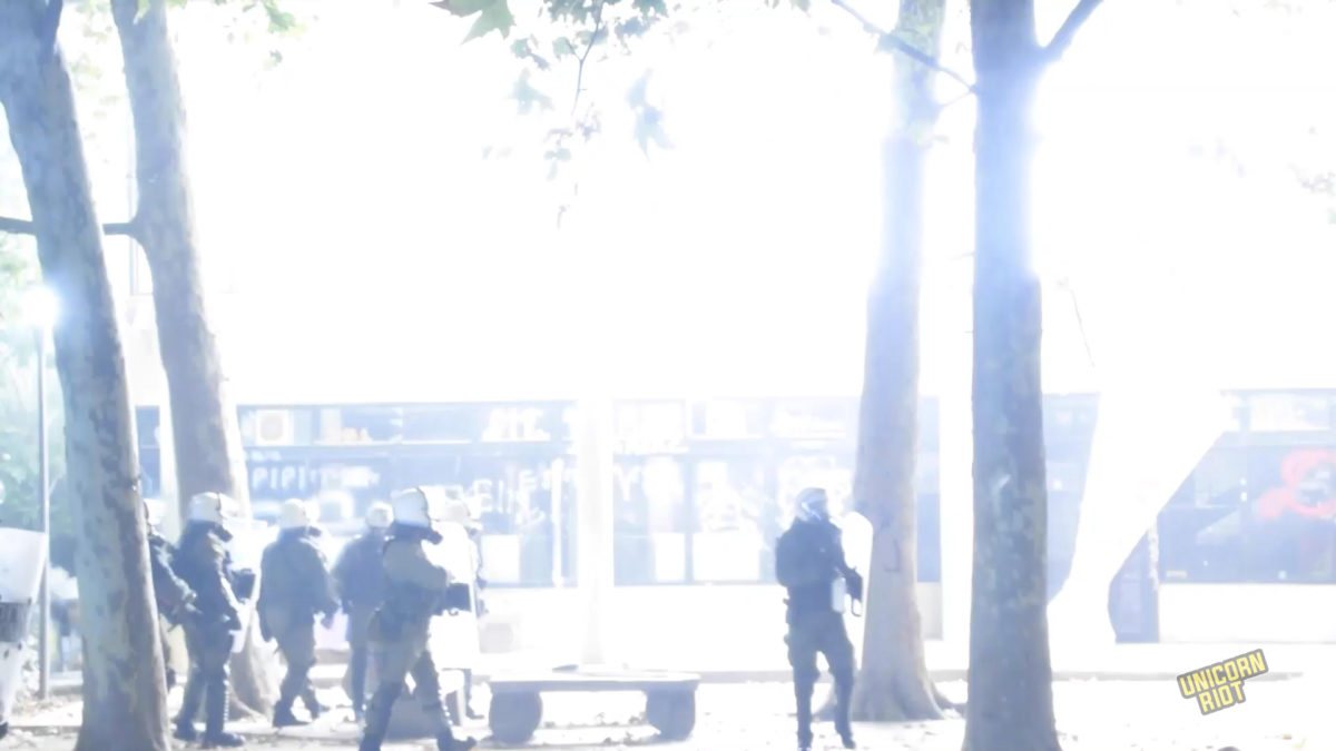 Flashbang grenades go off in a building at the Polytechnic University on Nov. 17, 2022, after riot police throw them at trapped demonstrators during heavy clashes after the main demonstration against the former ruling military junta.