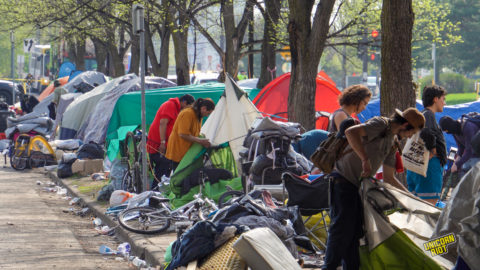 Franklin Avenue Minneapolis, Homeless encampment raided, campers gather their belongings out of their tents