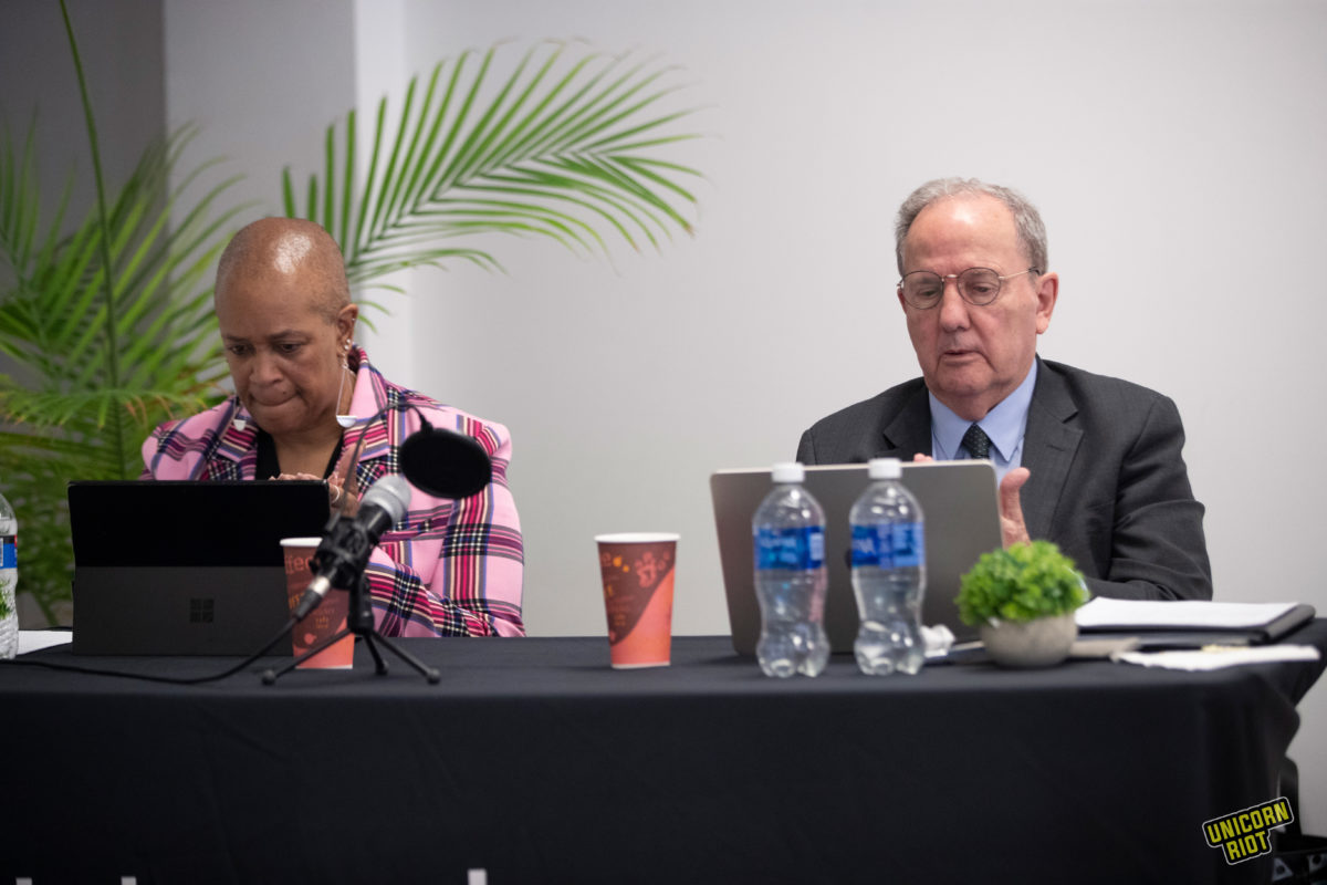 Tracie Keesee and Juan Méndez, from the International Independent Expert Mechanism to Advance Racial Justice and Equality in the Context of Law Enforcement (EMLER), listen to testimonies during a meeting at the Minneapolis Urban League on May 2, 2023.