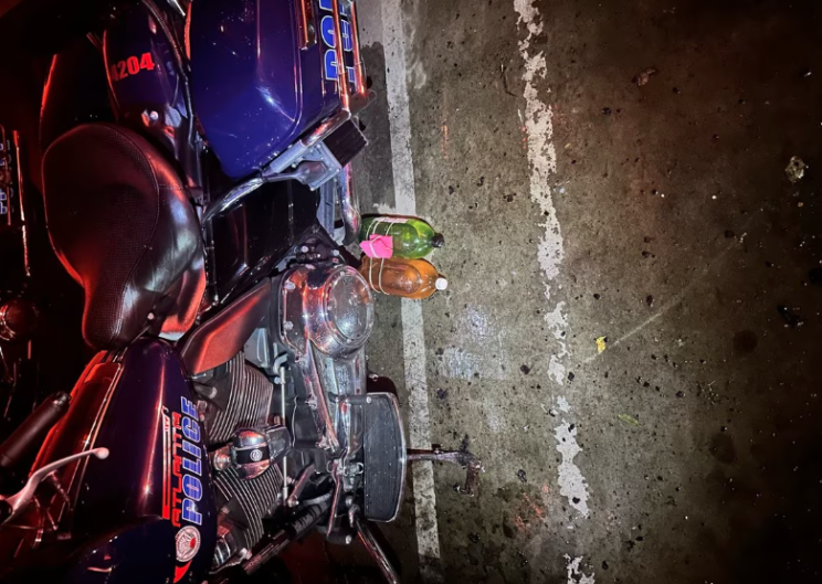 Two plastic bottles tied together in an alleged "incendiary device" apparently discovered unlit below an Atlanta Police Department motorcycle parked at the Atlanta Police Training Academy.