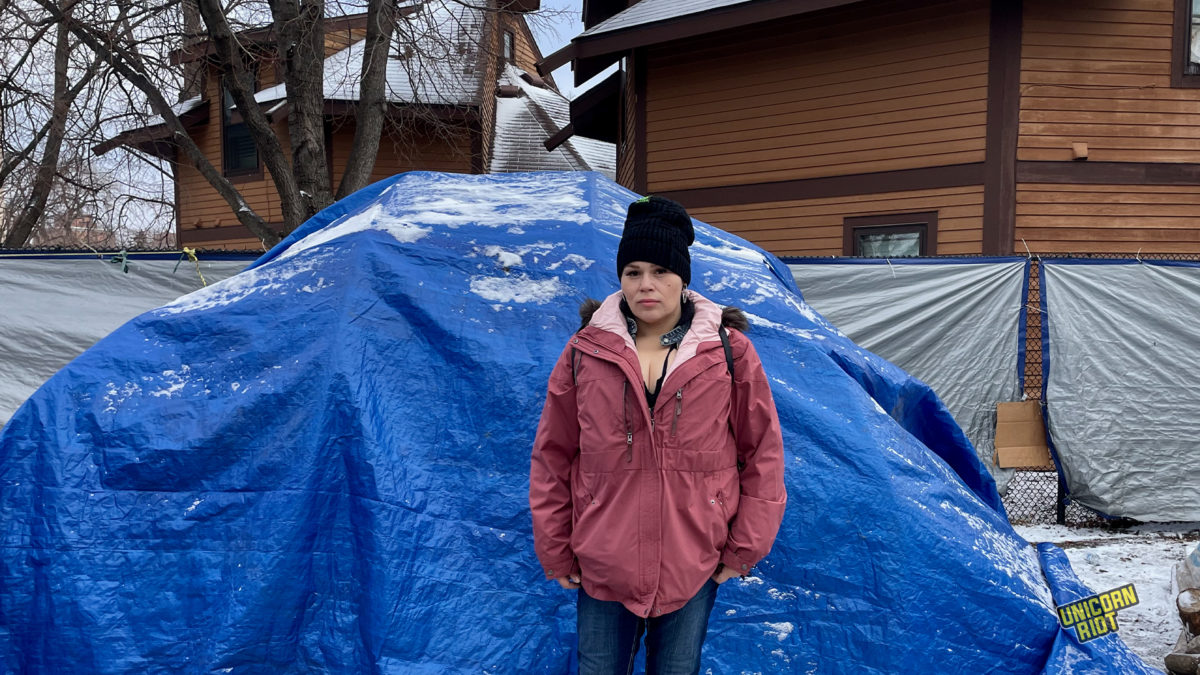 Jennessey Roberts sits inside the “healing tent” at Camp Nenookaasi
8642: Jennessey Roberts stands in front of the tent that used to be hers before she moved into a subsidized apartment unit last week